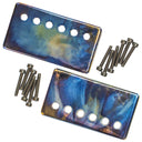 A Mojotone nebula 50mm humbucker pickup cover and polepiece set isolated on a white background.