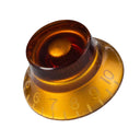 A Mojotone top hat guitar knob in amber with numbers 1-10 in increments along the bottom of the knob.